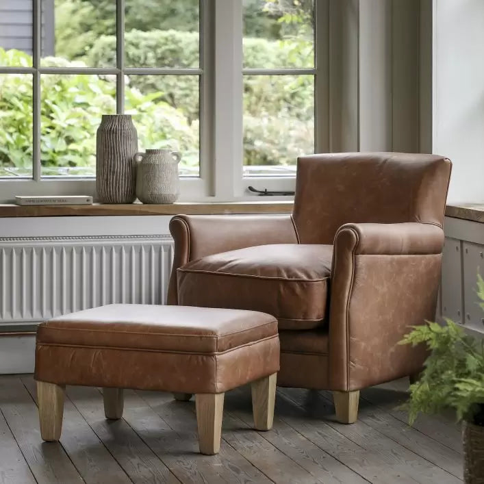 Leather armchair with footstool deals